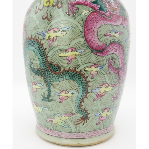 2374 - A CHINESE CELADON GROUND FAMILLE ROSE BALUSTER VASEdecorated with dragons amongst clouds and waves c... 