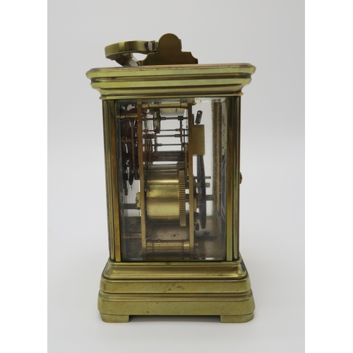 2153 - A LATE 19TH CENTURY GILT BRASS AND GLASS REPEATING CARRIAGE CLOCK the white dial with roman numerals... 