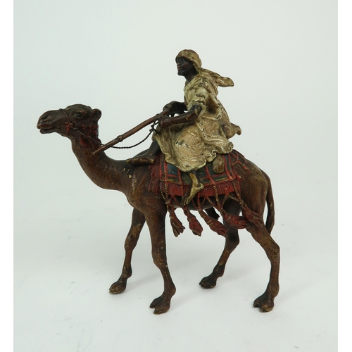 2154 - FRANZ BERGMAN (AUSTRIAN 1861-1936)A cold painted bronze figure of an Arab man, sitting on a camel an... 