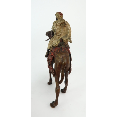 2154 - FRANZ BERGMAN (AUSTRIAN 1861-1936)A cold painted bronze figure of an Arab man, sitting on a camel an... 