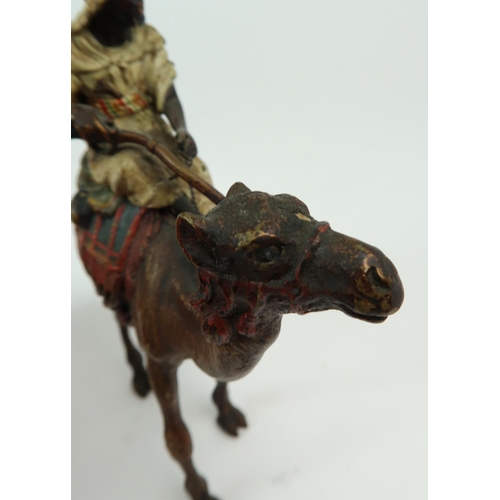 2154 - FRANZ BERGMAN (AUSTRIAN 1861-1936)A cold painted bronze figure of an Arab man, sitting on a camel an... 