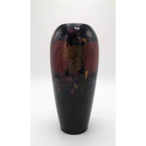 2158 - A MOORCROFT POMEGRANATE VASE of shouldered tapering form, with paper label to the base, 31cm high... 