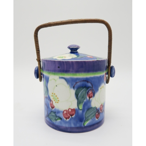 2166 - RICHARD AMOUR FOR BOUGH POTTERY A Magnolia pattern biscuit barrel with wicker handle, 16cm high, a m... 