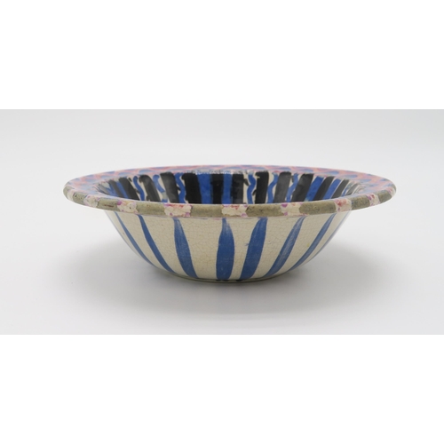 2168 - JESSIE MARION KING (SCOTTISH 1875-1949)A hand painted pottery bowl with geometric decoration in blac... 