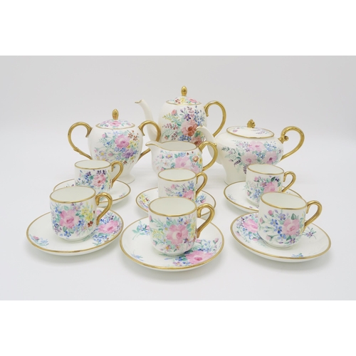 2172 - MARY L FAIRGRIEVE (Scottish 1875-1969) A hand painted tea/coffee service, decorated with bouquets of... 