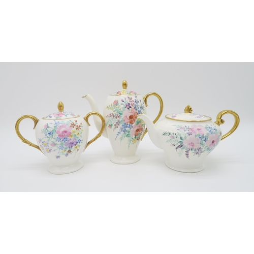 2172 - MARY L FAIRGRIEVE (Scottish 1875-1969) A hand painted tea/coffee service, decorated with bouquets of... 