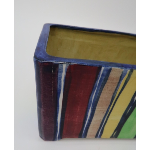 2181 - ELIZABETH MARY WATT (SCOTTISH 1886-1954)A rainbow stripe rectangular planter, a tea plate painted wi... 