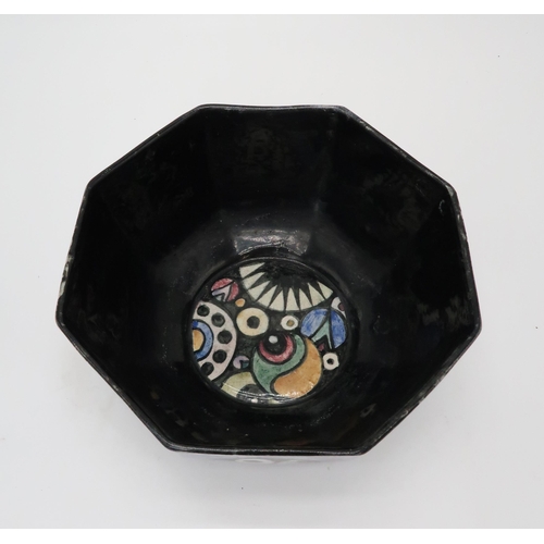 2182 - ELIZABETH MARY WATT (SCOTTISH 1886-1954)An octagonal bowl, the black ground with geometric roundels ... 