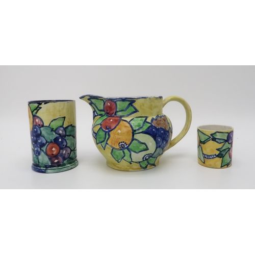 2183 - ELIZABETH MARY WATT (SCOTTISH 1886-1954)A collection of fruit painted pottery, including a plate, 24... 