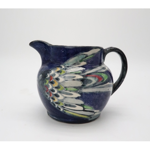 2187 - ELIZABETH MARY WATT (SCOTTISH 1886-1954)A bird painted jug with dark blue ground, signed EM Watt, 11... 