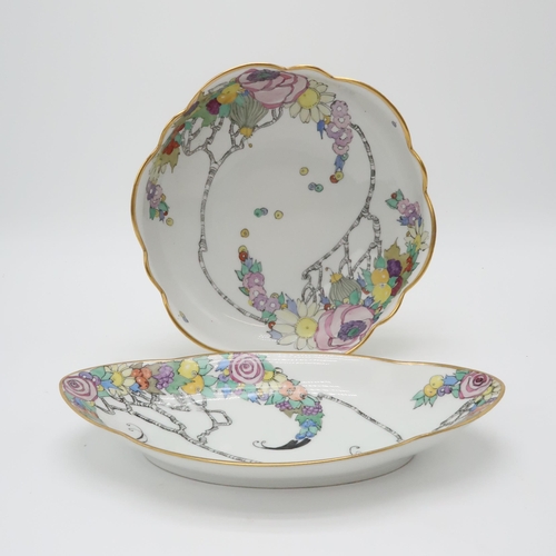 2192 - ELIZABETH MARY WATT (SCOTTISH 1886-1954)A large circular porcelain dish with wavy edge, painted with... 