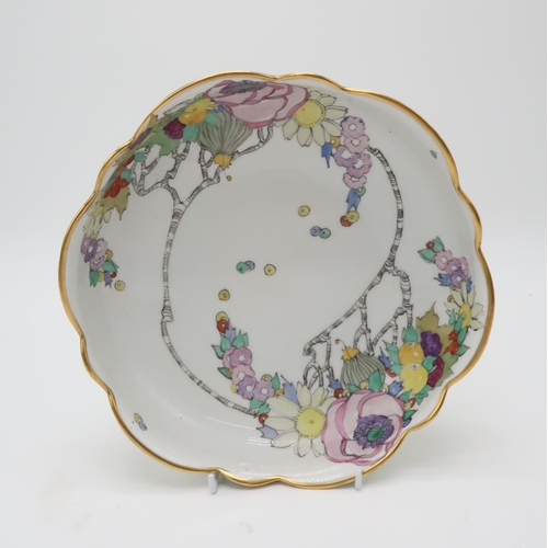 2192 - ELIZABETH MARY WATT (SCOTTISH 1886-1954)A large circular porcelain dish with wavy edge, painted with... 