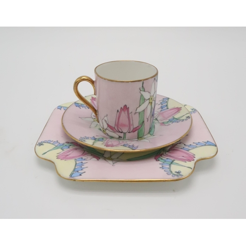 2195 - ELIZABETH MARY WATT (SCOTTISH 1886-1954)A delicately painted spring flower coffee trio with pink gro... 