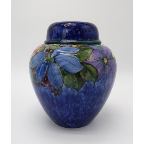 2198 - MARY A RAMSAY FOR STRATHYRE POTTERY GINGER JAR AND COVERthe dark blue ground with painted flower dec... 