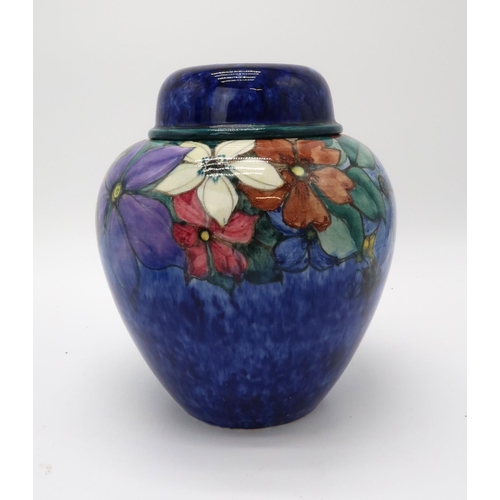 2198 - MARY A RAMSAY FOR STRATHYRE POTTERY GINGER JAR AND COVERthe dark blue ground with painted flower dec... 