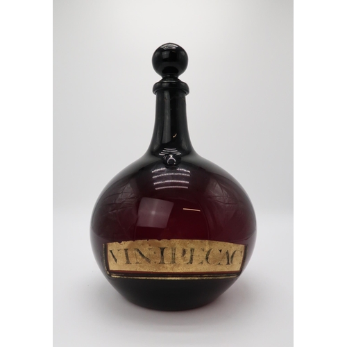 2202 - A 19TH CENTURY ONION SHAPED PURPLE GLASS CHEMIST DISPLAY BOTTLE AND STOPPERwith applied and painted ... 