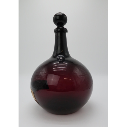 2202 - A 19TH CENTURY ONION SHAPED PURPLE GLASS CHEMIST DISPLAY BOTTLE AND STOPPERwith applied and painted ... 