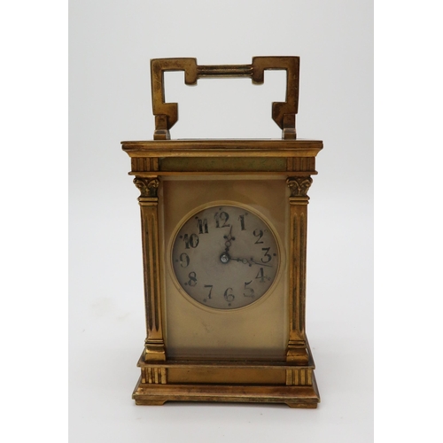 2204 - A FRENCH BRASS AND GLASS CARRIAGE CLOCKthe silvered dial with Arabic numerals, the case with an acan... 