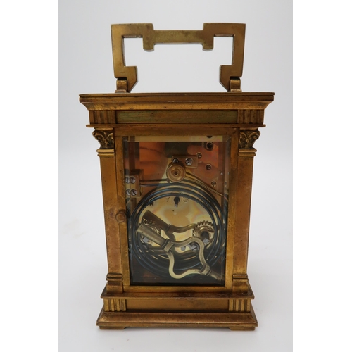 2204 - A FRENCH BRASS AND GLASS CARRIAGE CLOCKthe silvered dial with Arabic numerals, the case with an acan... 