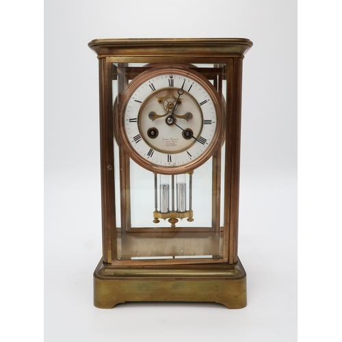 2205 - A LATE 19TH CENTURY FRENCH BRASS AND GLASS MANTEL CLOCKthe white enamel dial with roman numerals and... 