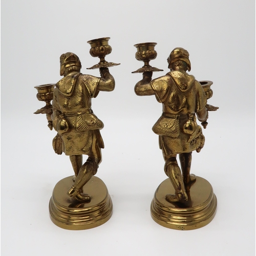 2207 - A PAIR OF GILT BRONZE FIGURAL CANDLESTICKSeach modelled as a man, upon oval socle bases, 24.5cm high... 