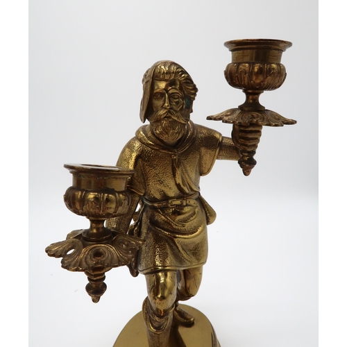 2207 - A PAIR OF GILT BRONZE FIGURAL CANDLESTICKSeach modelled as a man, upon oval socle bases, 24.5cm high... 