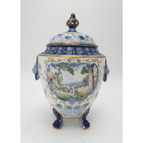 2209 - A ROYAL CROWN DERBY URN AND COVERthe body with lion's head masks and upon four paw feet, the white a... 