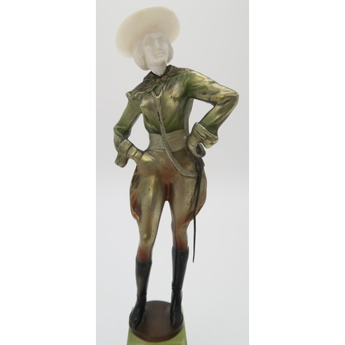 2220 - A PATINATED BRONZE AND IVORY ART DECO FIGURE OF A COWGIRLpossibly by Joseph Lorenzl, standing with h... 