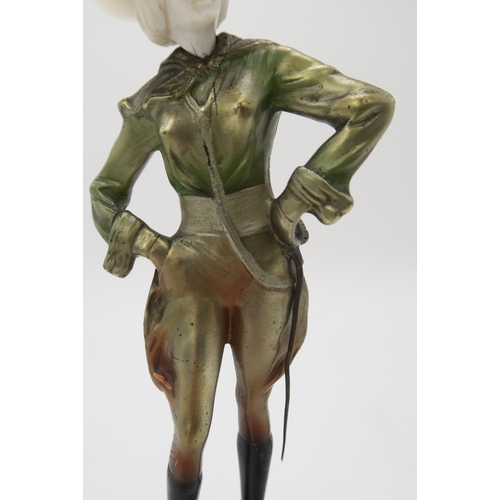 2220 - A PATINATED BRONZE AND IVORY ART DECO FIGURE OF A COWGIRLpossibly by Joseph Lorenzl, standing with h... 