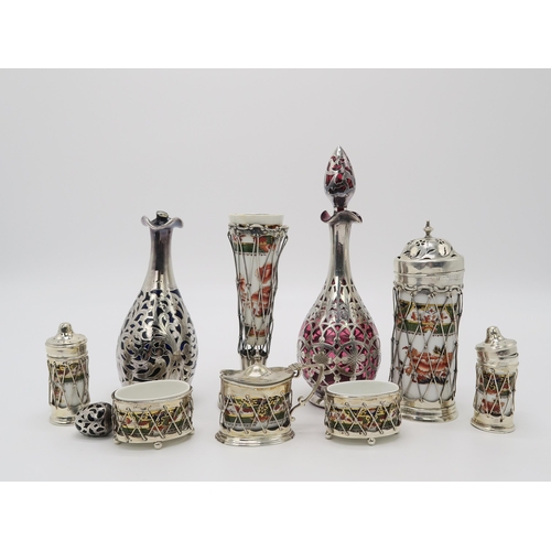 2466 - AN EDWARDIAN SILVER MOUNTED PORCELAIN CRUET SETthe porcelain by Copelands Spode, in an Imari palette... 