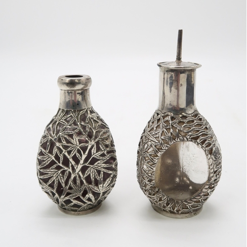 2471 - A CASED PAIR OF CHINESE EXPORT SILVER OVERLAID DIMPLE DECANTERSone with pierced and engraved bamboo ... 