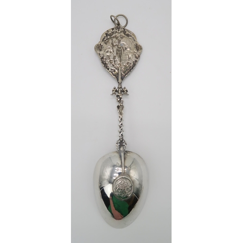 2474 - A DUTCH SILVER SPOONwith a twisting handle and a cast terminal with decoration of a figure of Justic... 