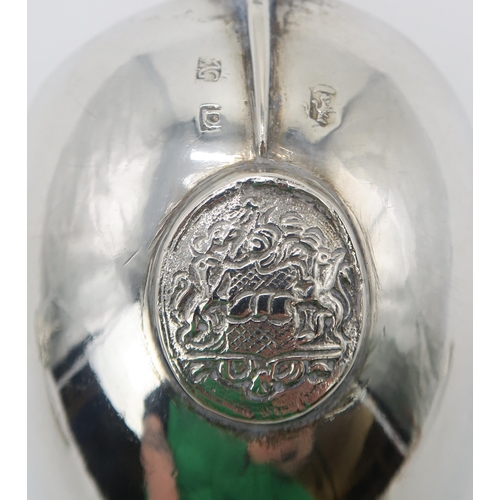 2474 - A DUTCH SILVER SPOONwith a twisting handle and a cast terminal with decoration of a figure of Justic... 