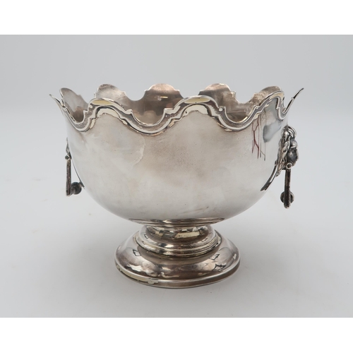 2481 - AN EDWARDIAN SILVER MONTEITHby Walker & Hall, Sheffield 1904, of typical form, with lion mask ha... 