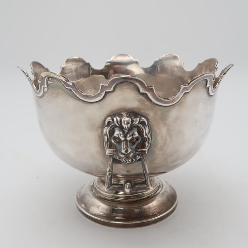 2481 - AN EDWARDIAN SILVER MONTEITHby Walker & Hall, Sheffield 1904, of typical form, with lion mask ha... 