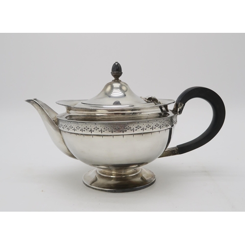 2482 - A GEORGE V SILVER TEAPOTby Roberts & Belk, Sheffield 1922, of squat circular form, with a band o... 