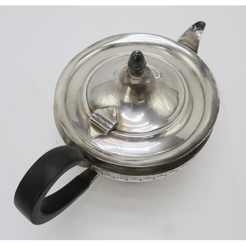 2482 - A GEORGE V SILVER TEAPOTby Roberts & Belk, Sheffield 1922, of squat circular form, with a band o... 