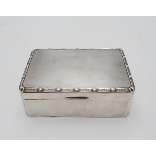 2484 - HAMILTON & INCHES;A George VI silver cigarette box, Edinburgh 1936, of canted rectangular form, ... 