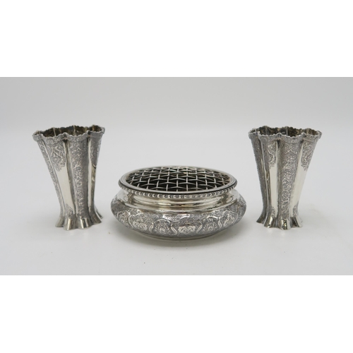 2488 - A PERSIAN SILVER FOOTED DISHof lobed form, the well decorated with a central floral medallion, the b... 