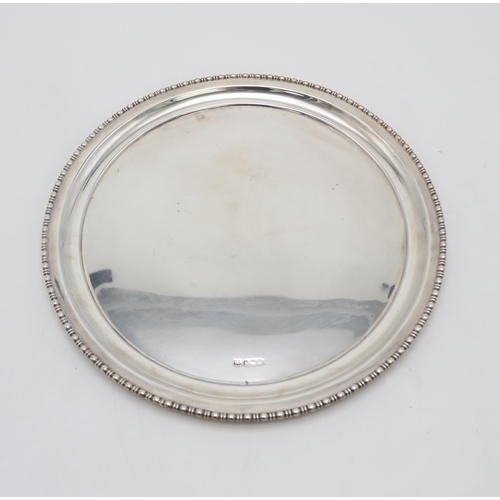 2491 - A GEORGE V SILVER CIRCULAR DISHby Fenton Brothers, Sheffield 1915, with a beaded notched rim, 549gms... 