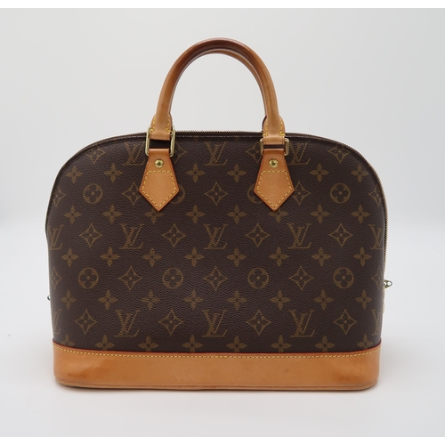 2580 - A LOUIS VUITTON M51130 BROWN MONOGRAM ALMAwith a dust bag, personalised to the leather 'C P', length... 