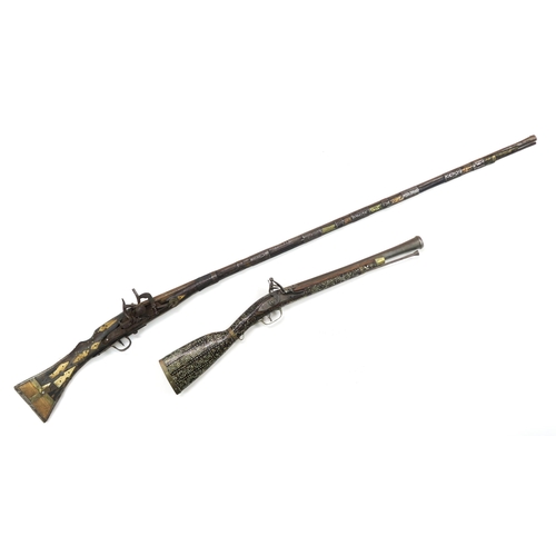 2627 - A HANDMADE AFGHAN FLINTLOCK JEZAIL The smooth-bore barrel measuring approx. 121cm in length and band... 