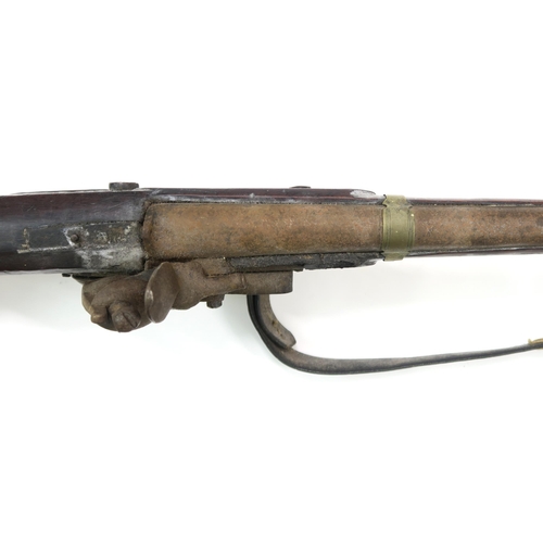 2632 - A FLINTLOCK MUSKET, LIKELY OF MIDDLE EASTERN ORIGINIncorporating a British flintlock mechanism engra... 