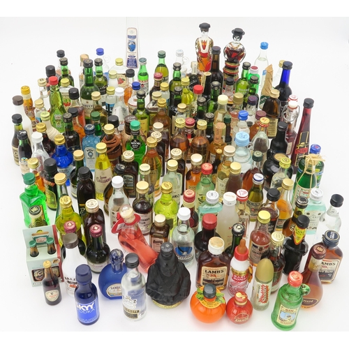 2662 - SCOTCH WHISKY MINIATURES together with a quantity of worldwide spirits