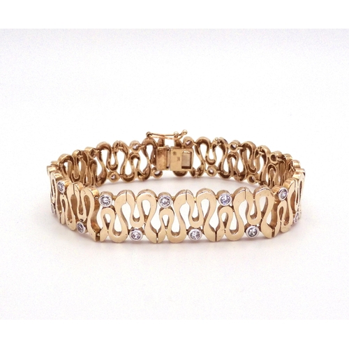 2701 - A 9CT GOLD WAVE PATTERN BRACELETinterspaced with sparkling cubic zirconia, length of the bracelet 18... 