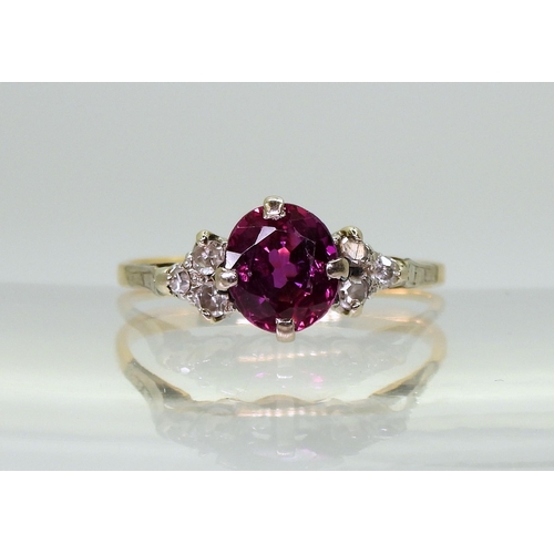 2703 - A VINTAGE RINGset with diamonds and a faux purple sapphire, mounted in bright yellow and white metal... 