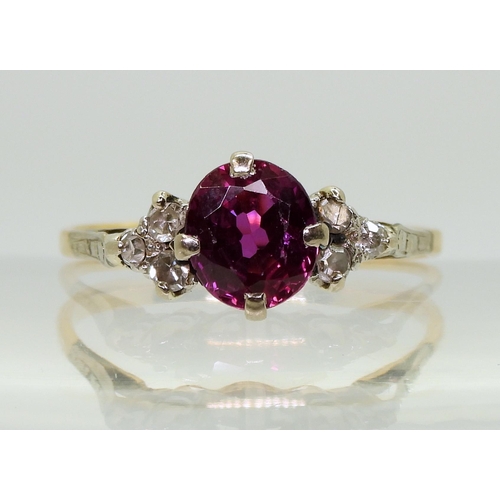 2703 - A VINTAGE RINGset with diamonds and a faux purple sapphire, mounted in bright yellow and white metal... 