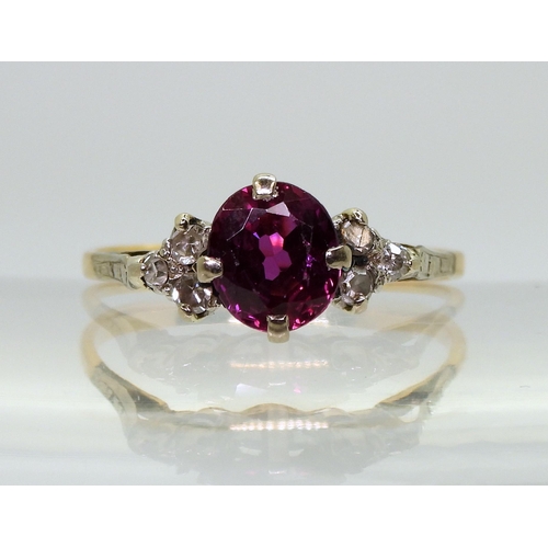 2703 - A VINTAGE RINGset with diamonds and a faux purple sapphire, mounted in bright yellow and white metal... 