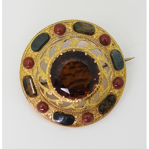 2705 - A SCOTTISH AGATE BROOCHthe bright yellow metal mount is extensively engraved with swags and a zig za... 