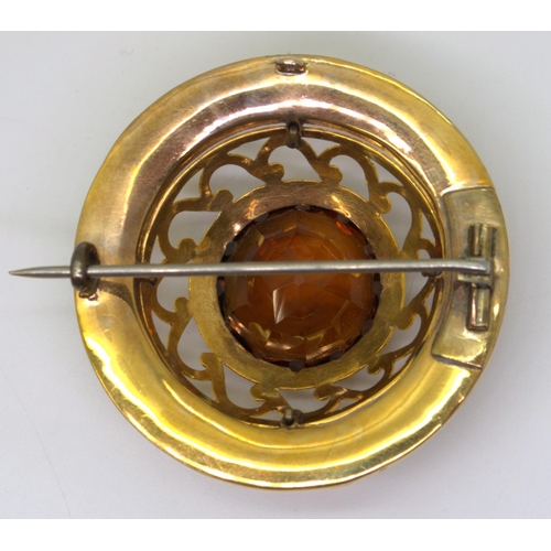 2705 - A SCOTTISH AGATE BROOCHthe bright yellow metal mount is extensively engraved with swags and a zig za... 